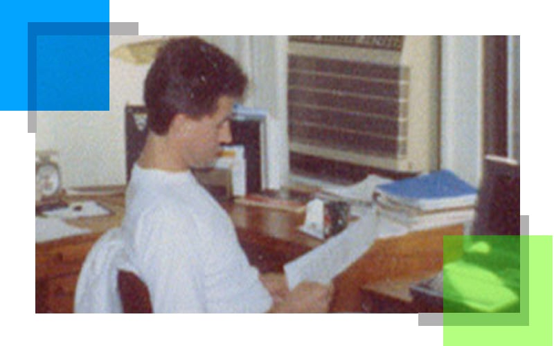 Archival photograph of Riverside founder Béla Szigethy working at a desk