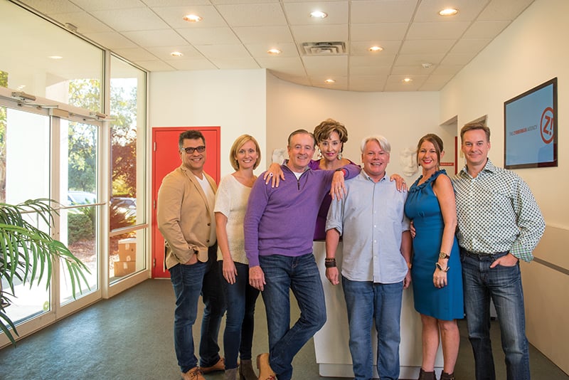 The Zimmerman Agency management team, including founders Curtis and Carrie Zimmerman, in the Tallahassee office