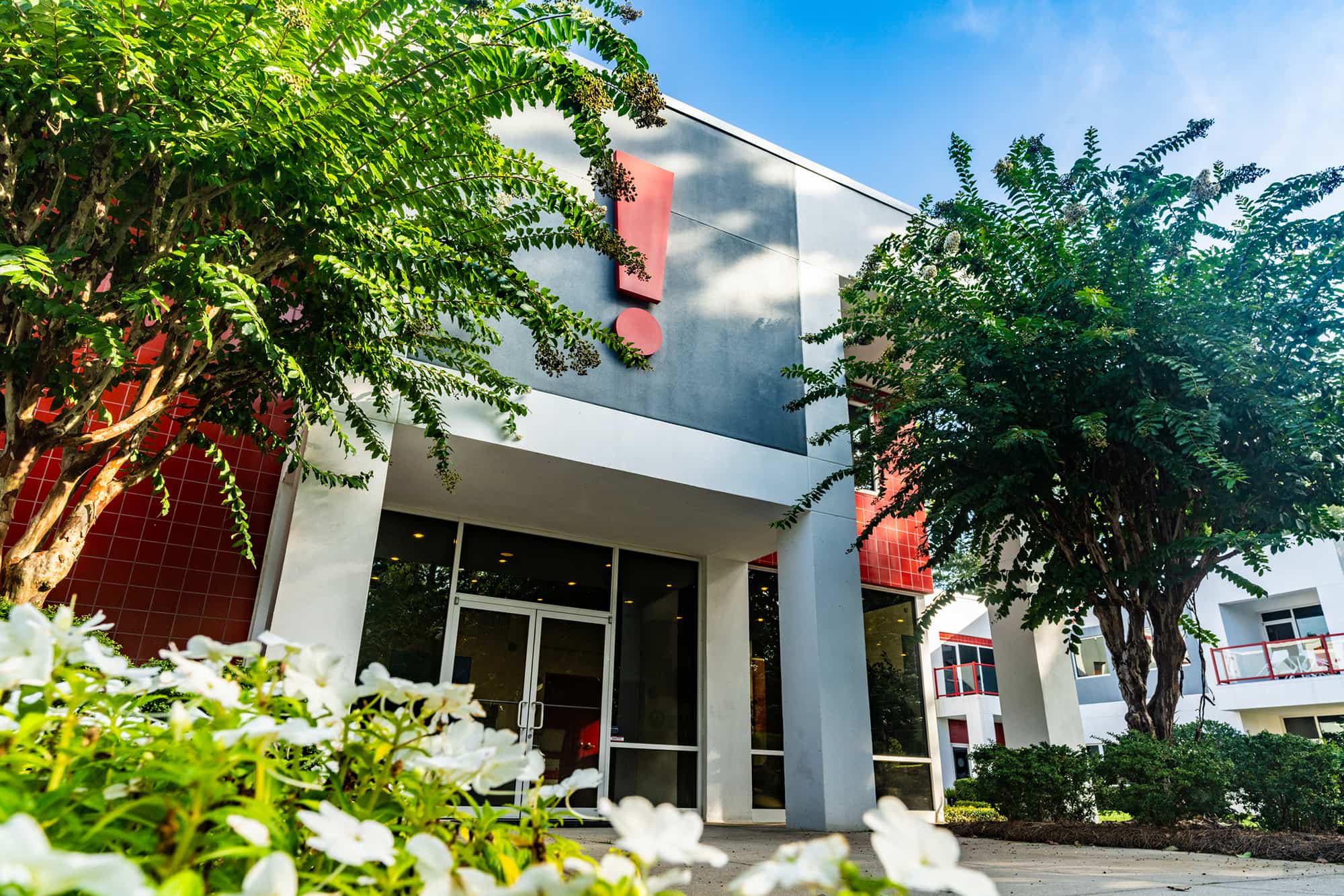 The Zimmerman Agency office in Tallahassee, framed by trees