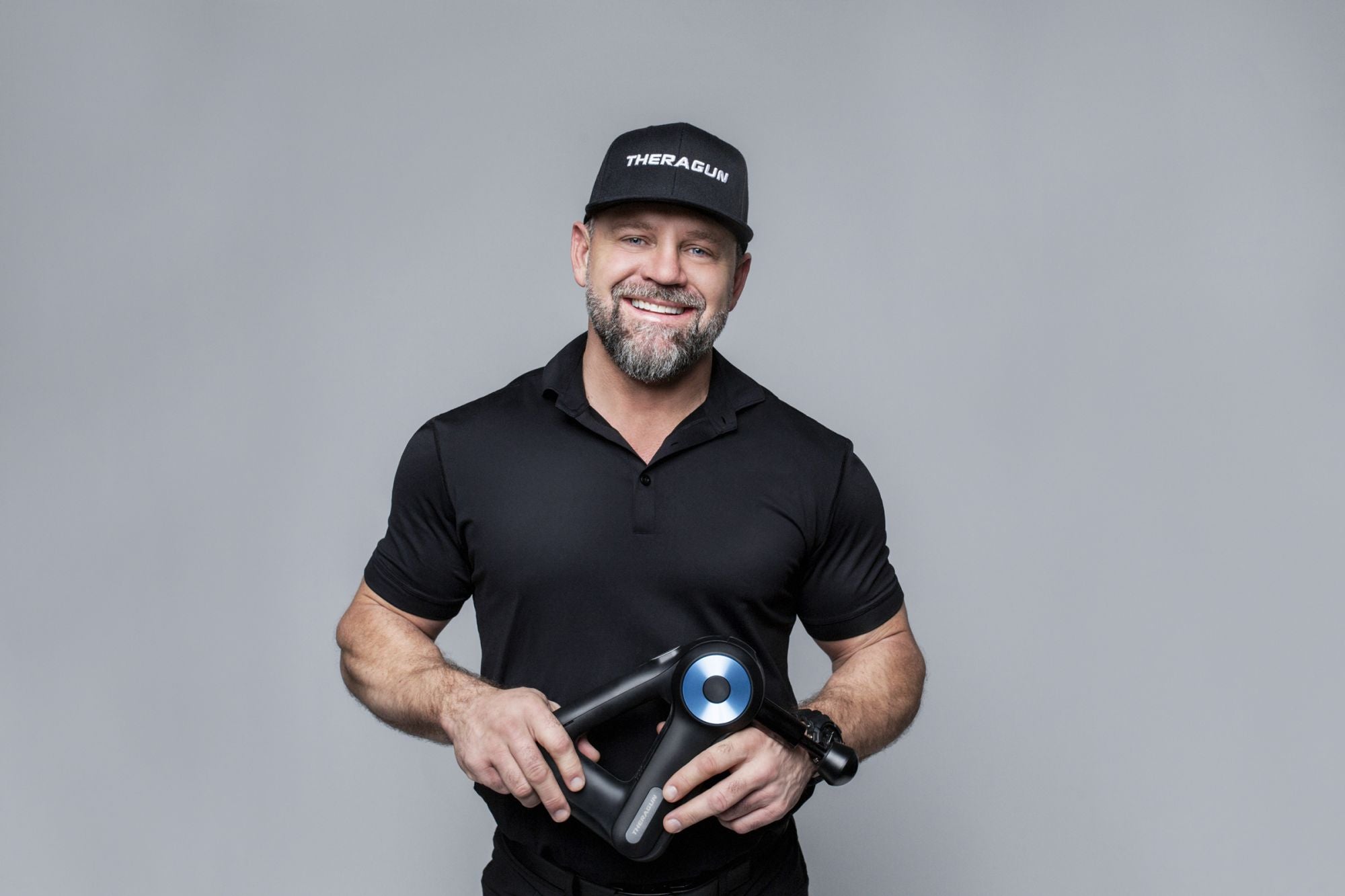 Therabody founder Jason Wersland holding a Theragun