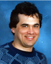 An archival photograph of a younger Thomas Neff wearing a patterned sweater