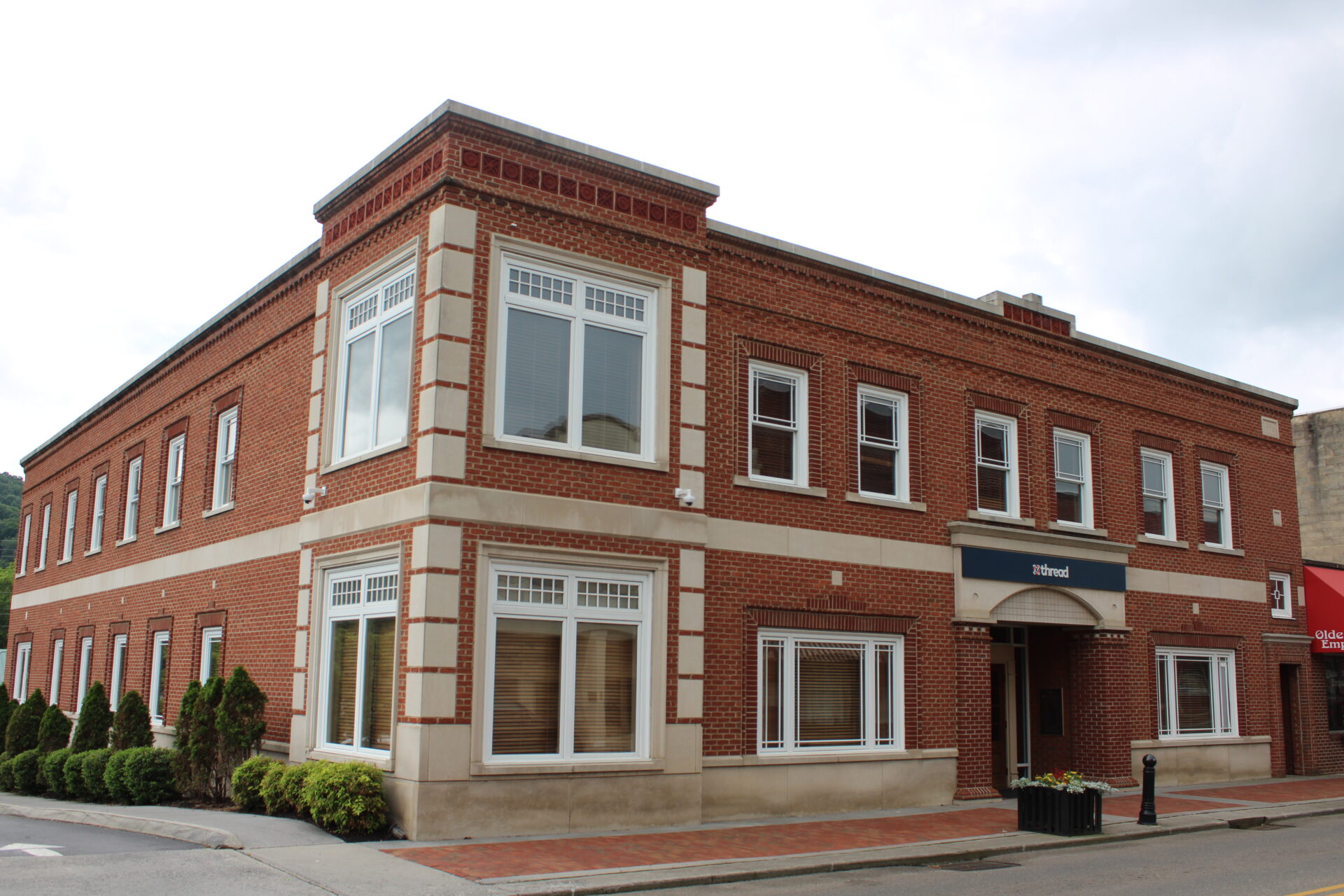 Thread’s brick bank building with white window trim in East Tennessee