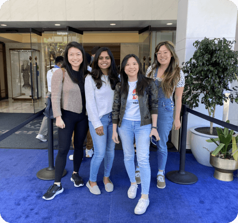 Four members of the Thunkable team posing at a company event