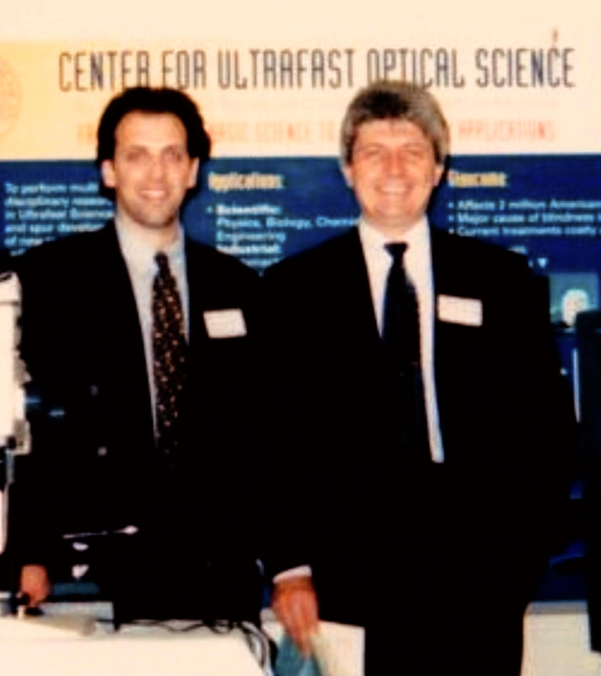 Ron Kurtz, left, and Tibor Juhasz, right, standing together at the Center for Ultrafast Optical Science around 1996