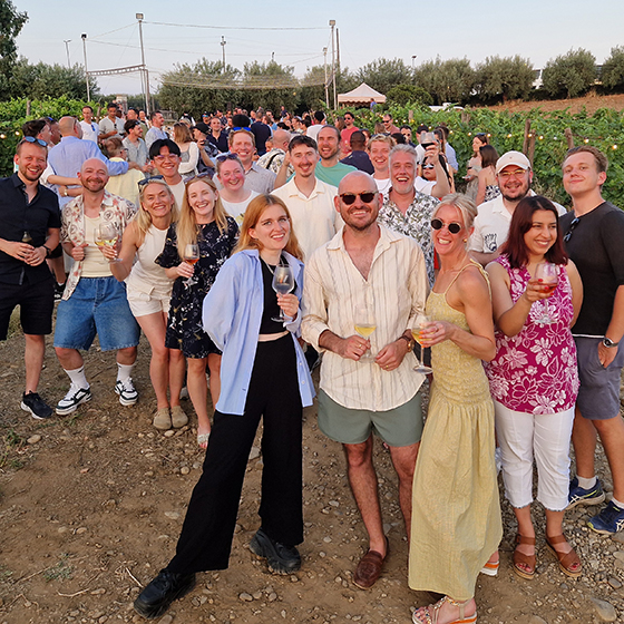Tillo colleagues gathered outdoors during a team event in Sicily