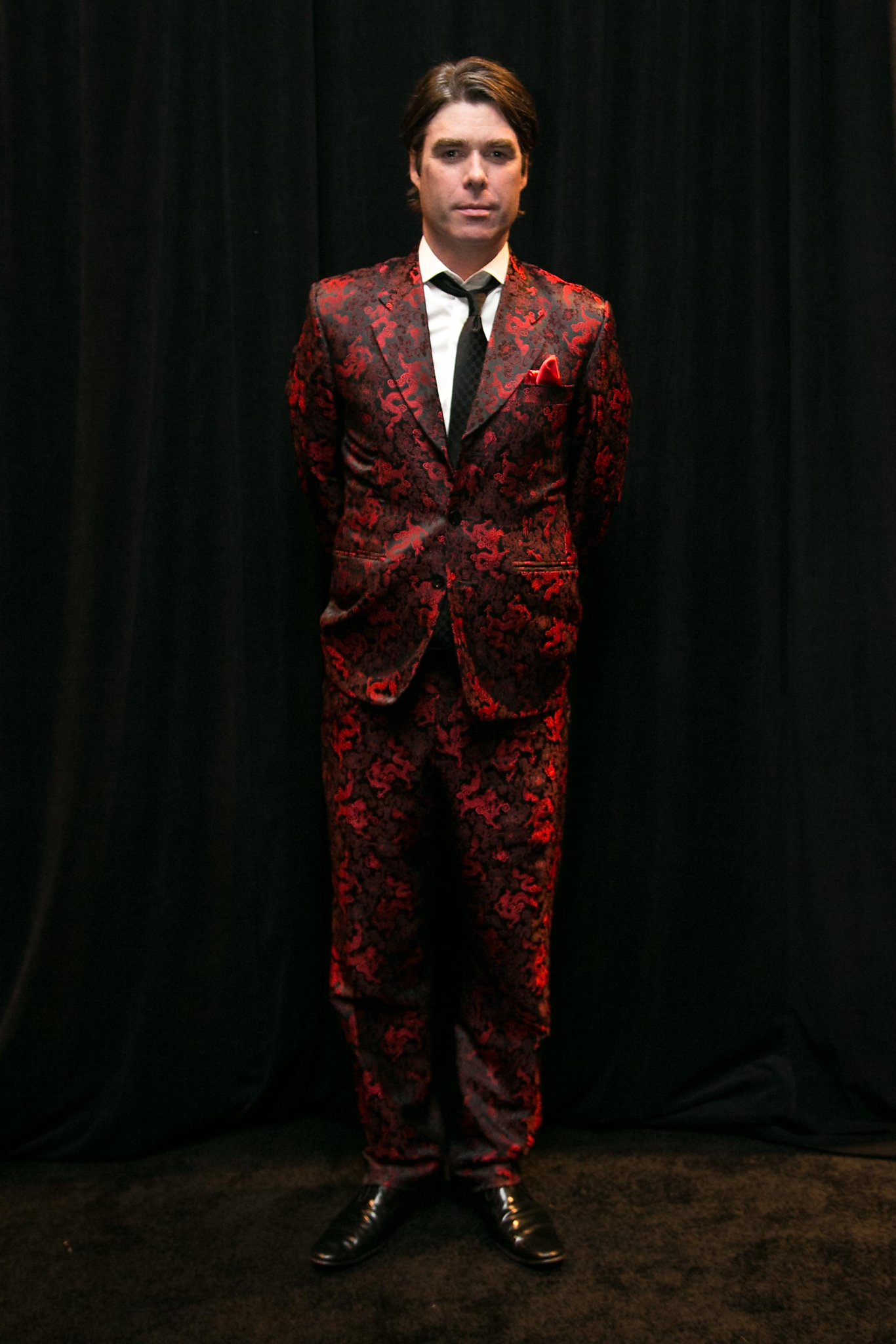 Tim Albinson wearing a red and black patterned vintage suit at SFMOMA’s Modern Ball in 2016