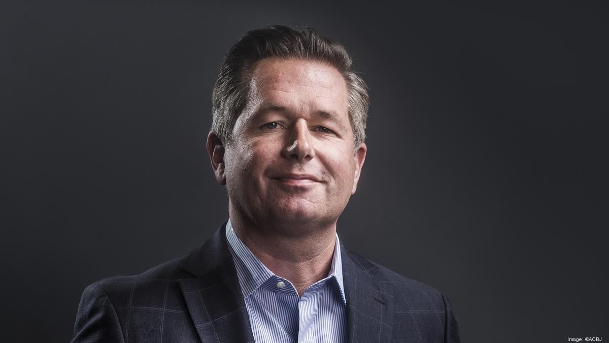 Tim Danker in a dark blazer and blue shirt, photographed for the Kansas City Business Journal
