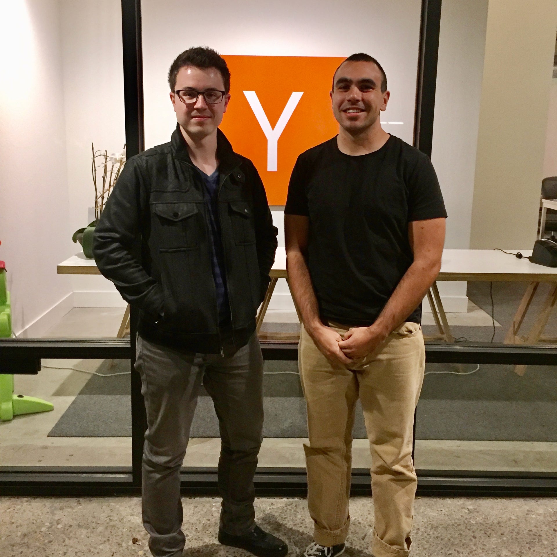 Tim Ellis on the left and Jordan Noone standing at Y Combinator