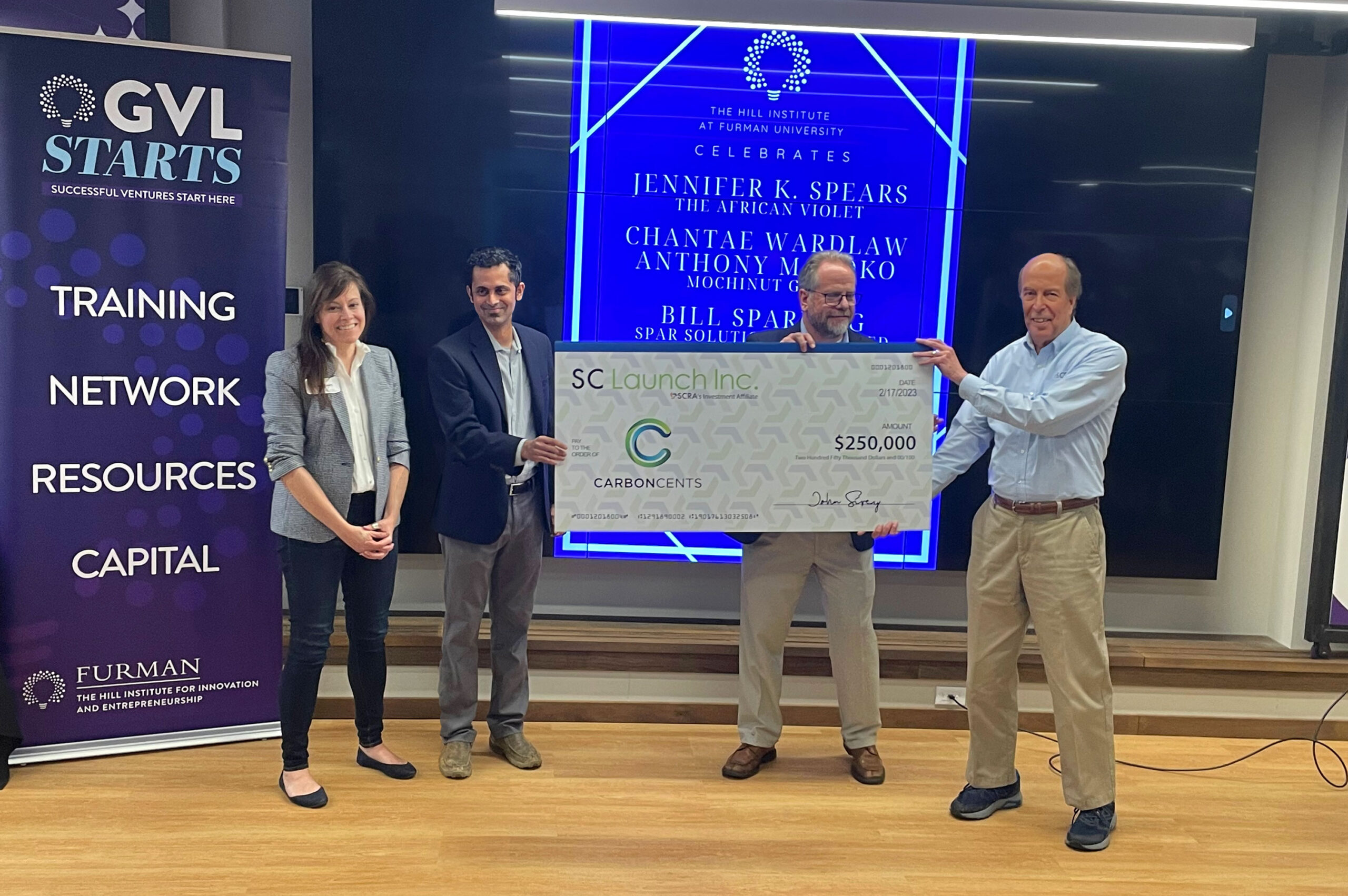 Tim Howard and the CarbonCents team receiving an SC Launch investment check