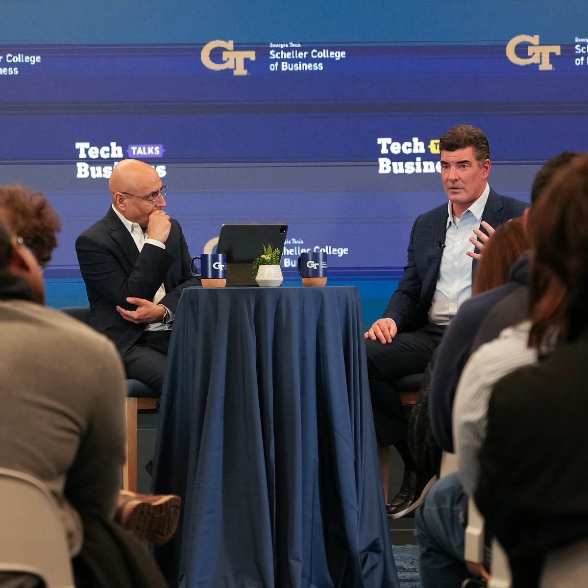 Tim Oliver, right, speaking with Anuj Mehrotra at Georgia Tech’s Tech Talks Business event