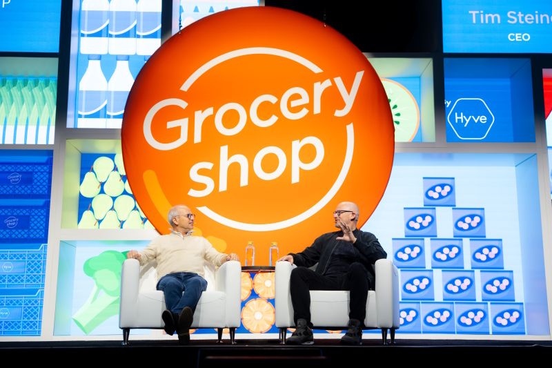 Tim Steiner and Chris Walton seated in discussion at GroceryShop 2025 in Las Vegas