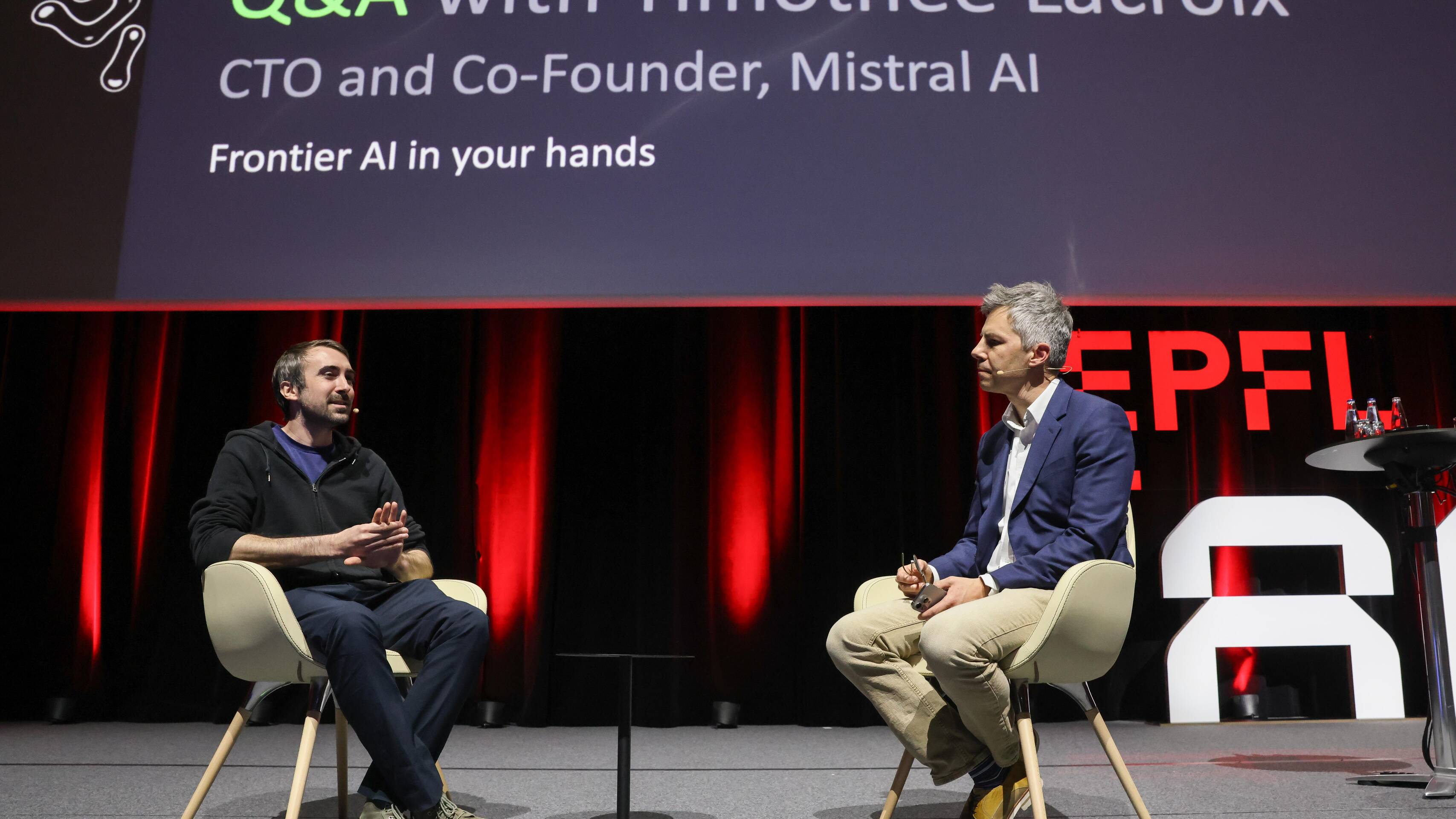 Timothée Lacroix speaking with Marcel Salathé onstage at EPFL in Lausanne