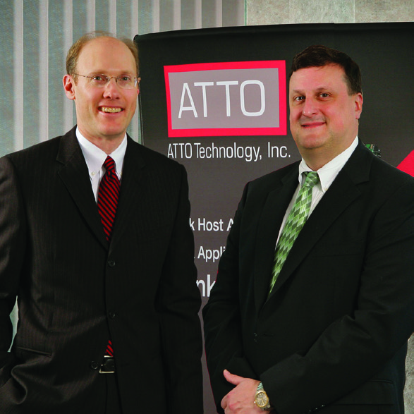 ATTO founders David Snell, left, and Timothy Klein, right, beside an ATTO display