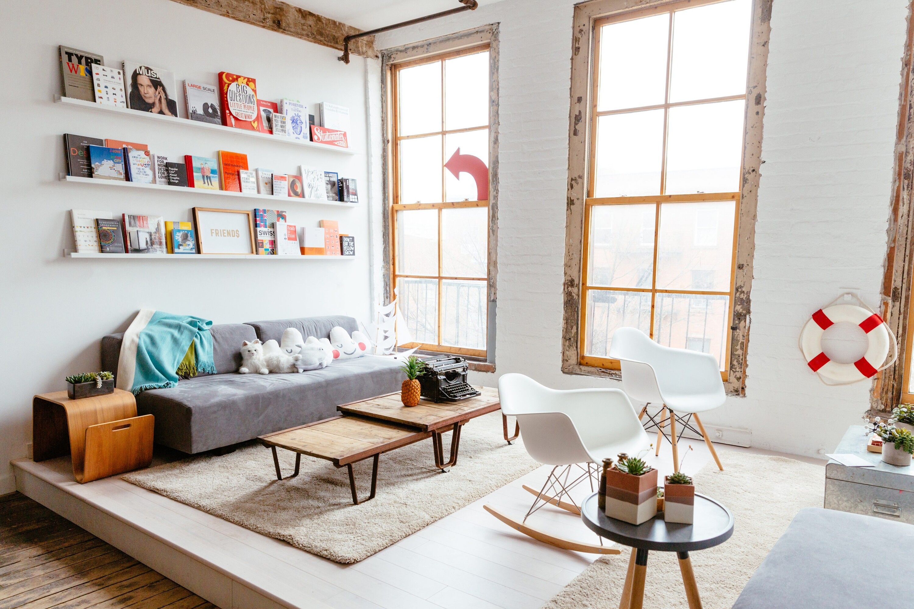 The shared tables and bright interior of the Friends Work Here coworking space in Brooklyn