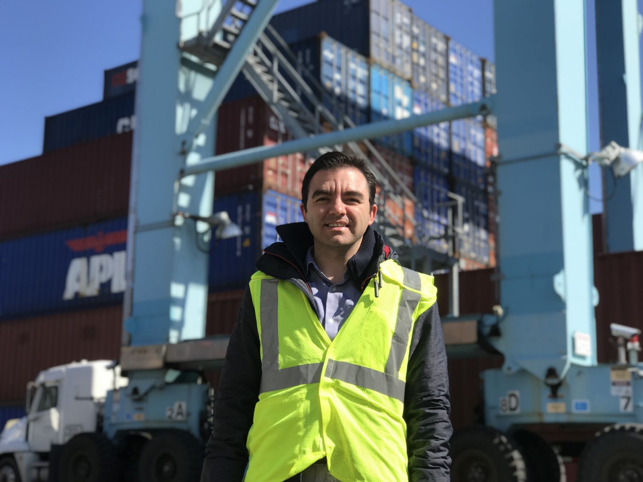 Tive founder Krenar Komoni wearing a high-visibility vest at a container terminal