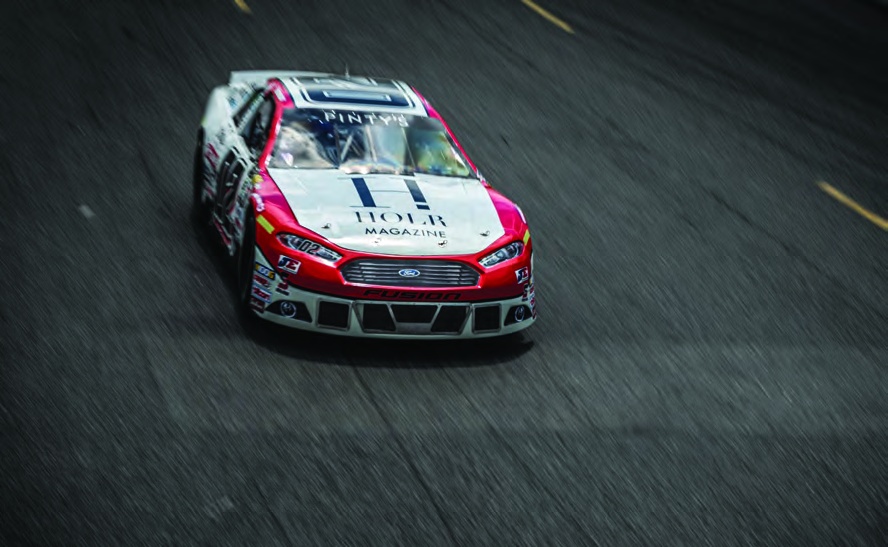 TJ Rinomato’s number 02 HOLR-branded Ford stock car on track