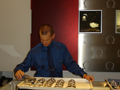 A Borsheims employee checking trays of watches