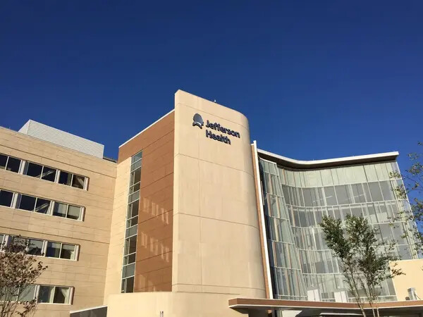 Jefferson Health building against a blue sky