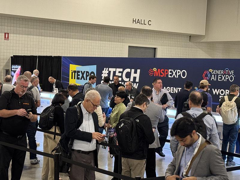 Attendees gather in front of ITEXPO, MSP Expo and Generative AI Expo signs at the 2026 event