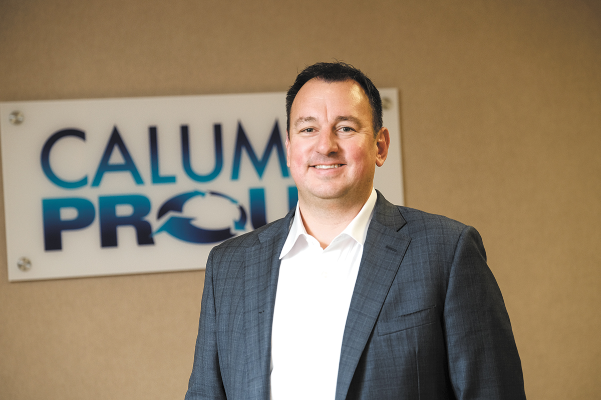 Todd Borgmann standing with his arms folded in a 2021 editorial photograph