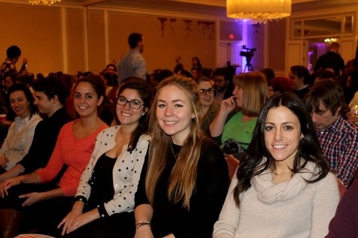 Brafton colleagues seated together at an annual Boston office meeting
