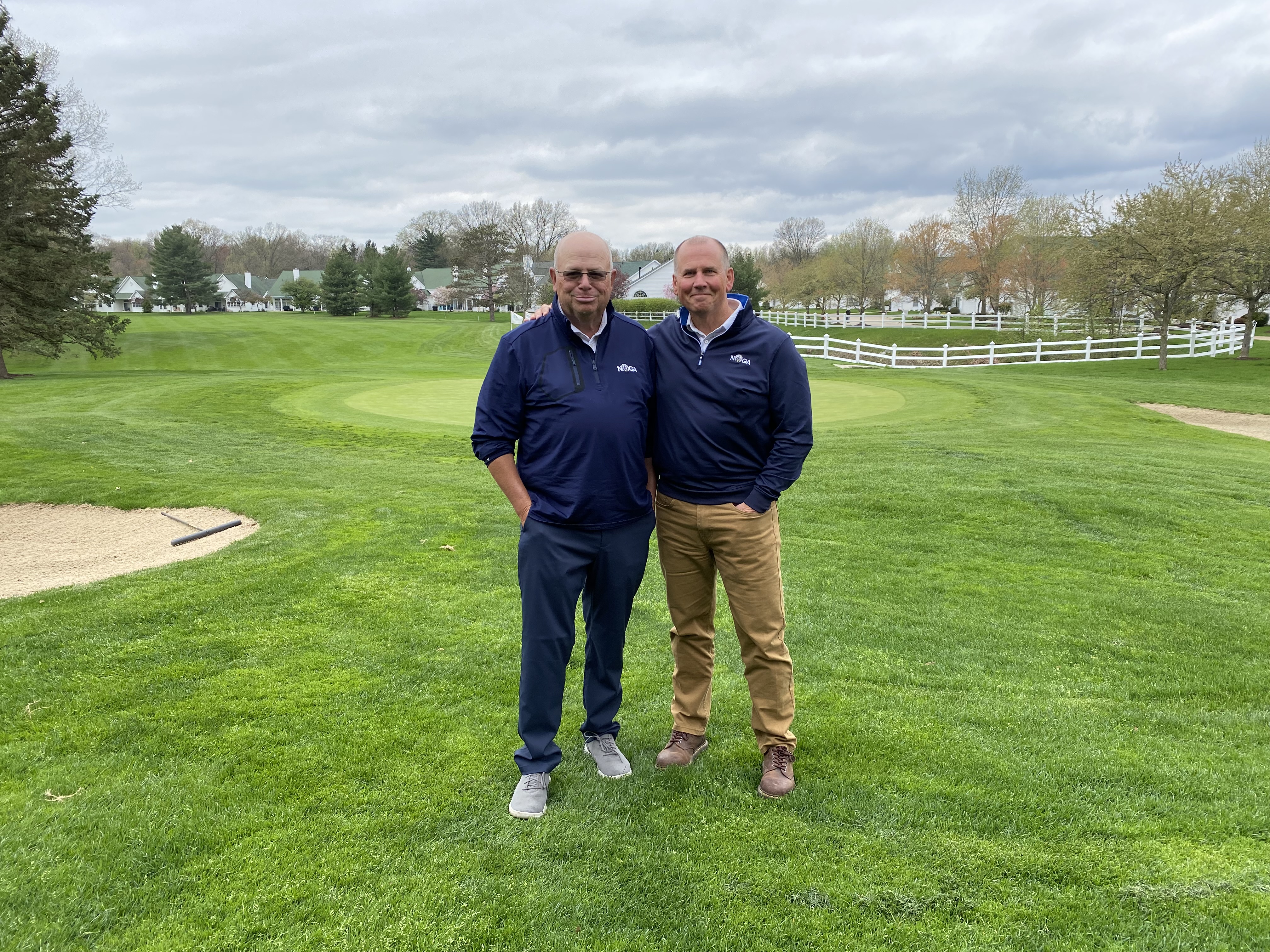 Two Northern Ohio Golf Association colleagues together on a golf course, accompanying the announcement of Tom Baugh’s presidency