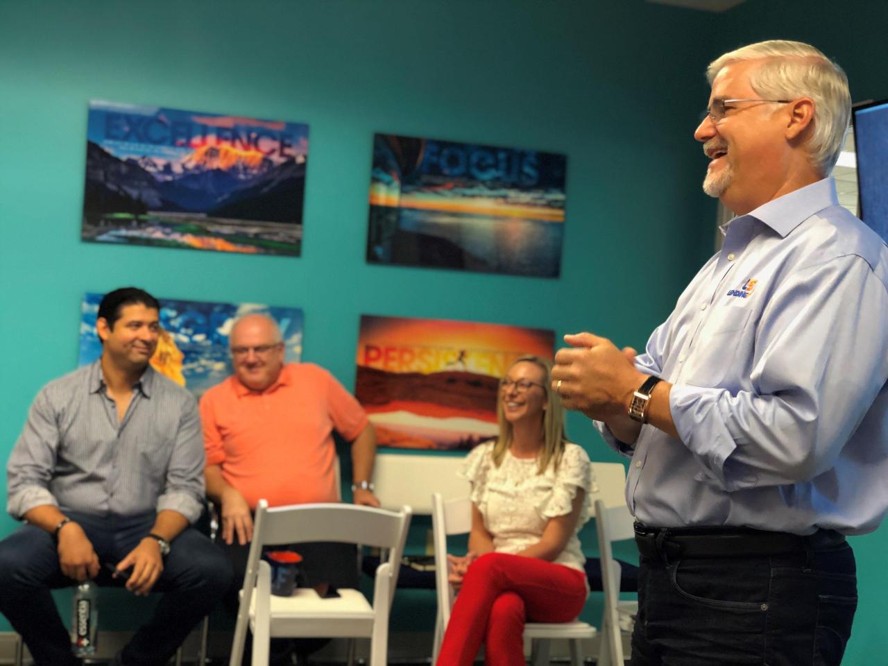 Tom Burnside speaking to colleagues at a LendingPoint town hall