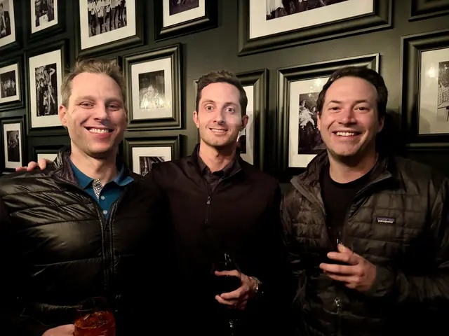 Tom Chavez at left in a candid photograph with two other people, from Ketch’s team photo collection