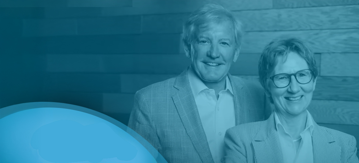 Tom Dent and Dr. Emer MacSweeney seated together in a Re:Cognition Health podcast portrait