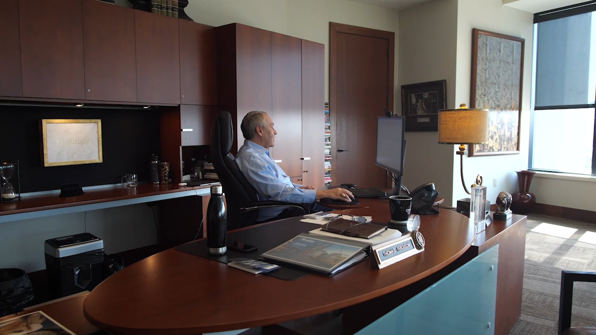 Tom Ferguson working at his desk in his office