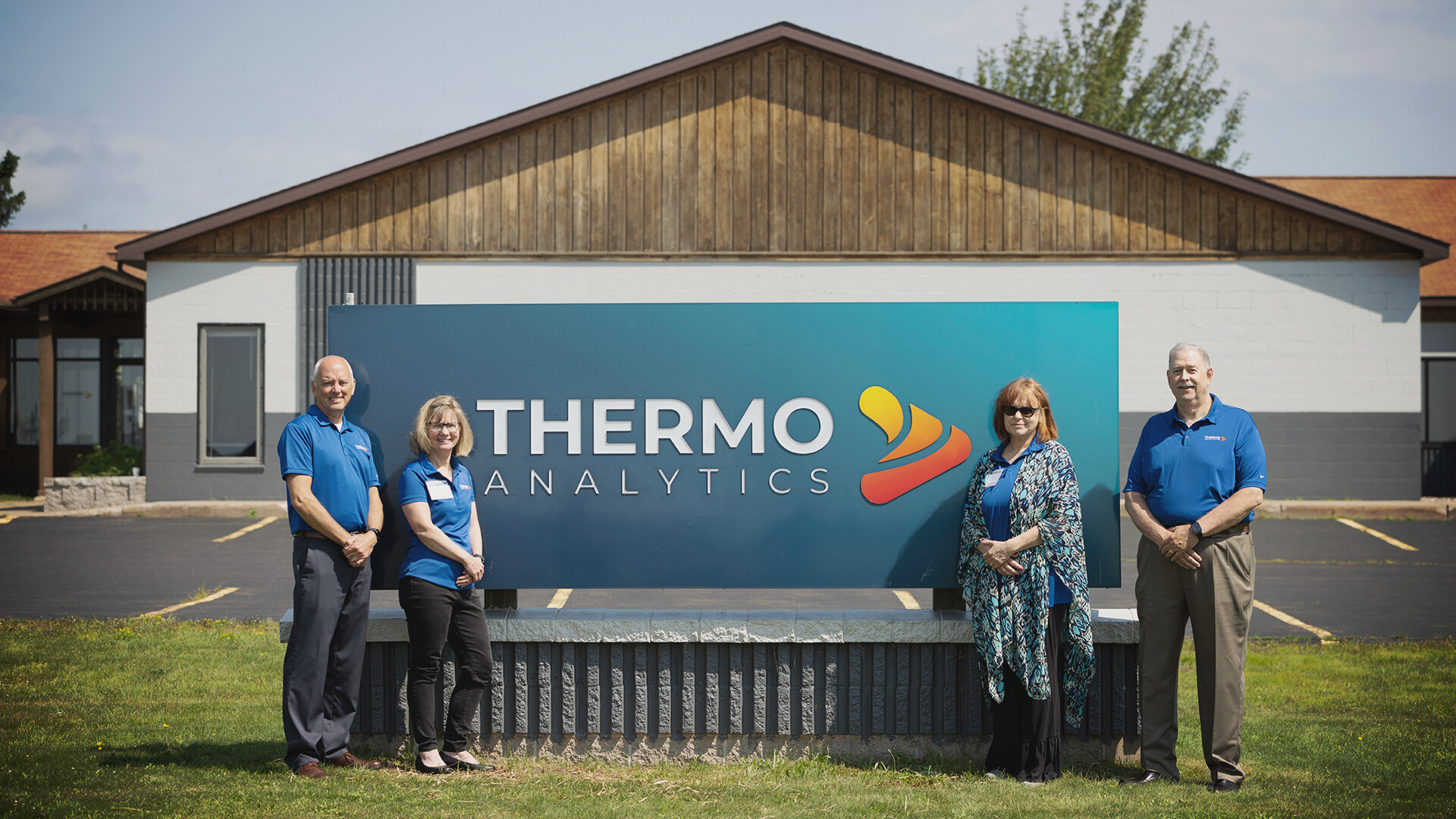 ThermoAnalytics executive team standing outside the company's Calumet headquarters