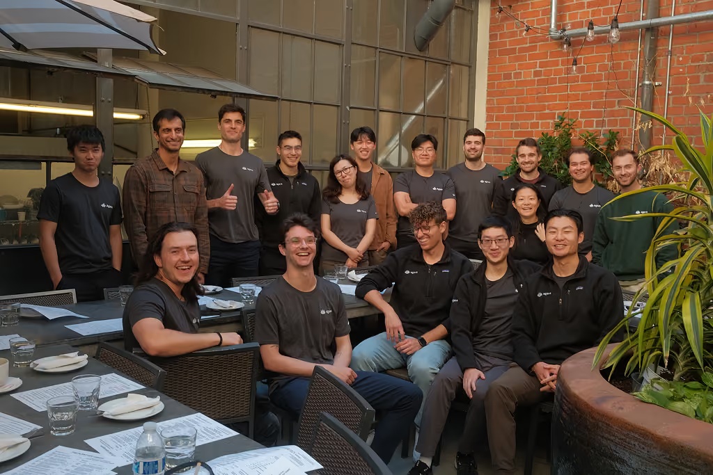 Tom Reno and members of the Agave team gathered around outdoor restaurant tables