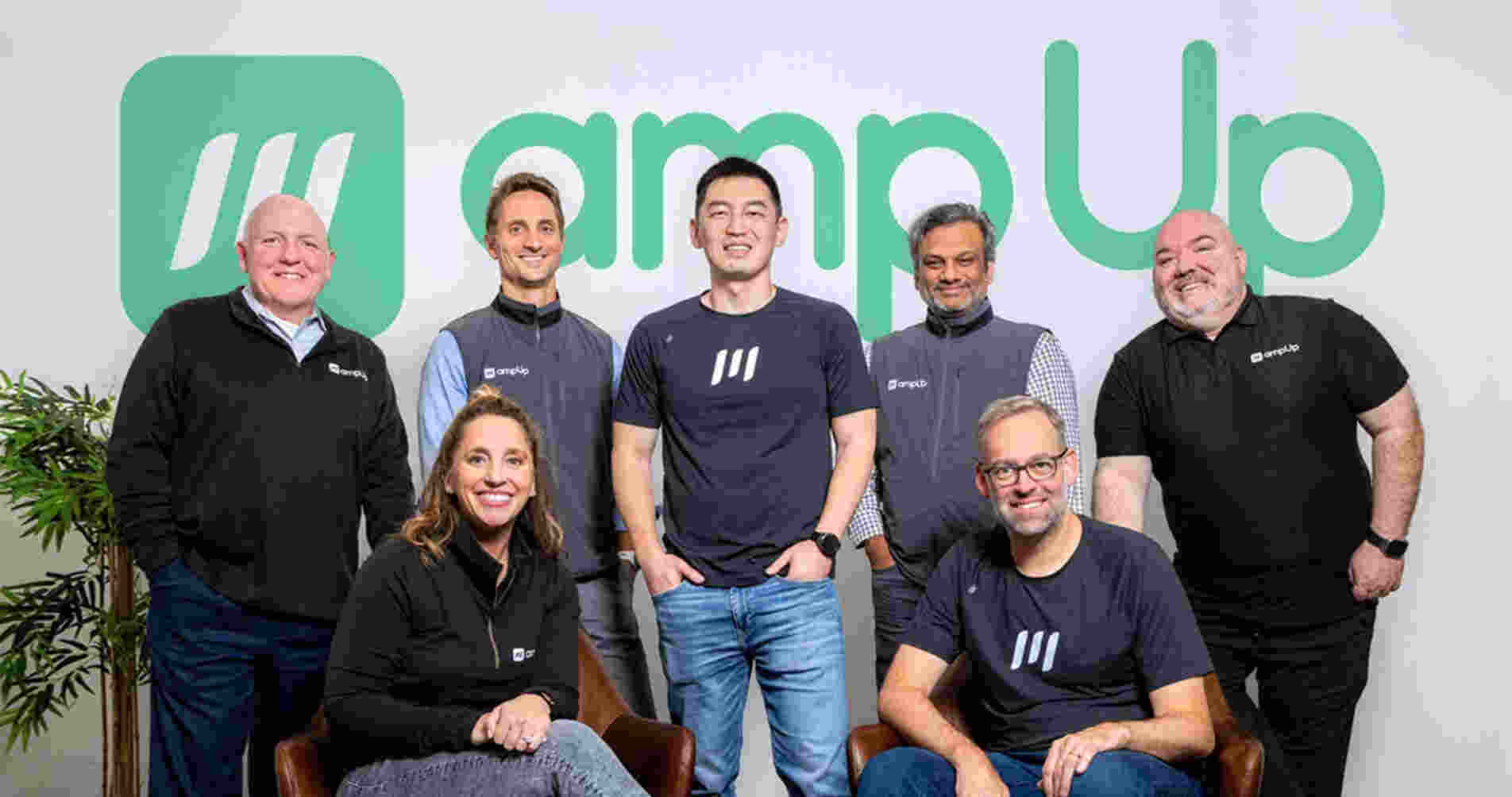 Tom Sun, standing in the center, with AmpUp's executive team in a 2024 press photograph