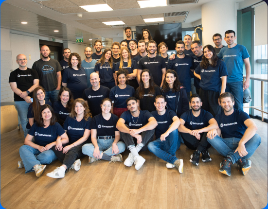 Tomorrow.io colleagues gathered in an office for a team photograph