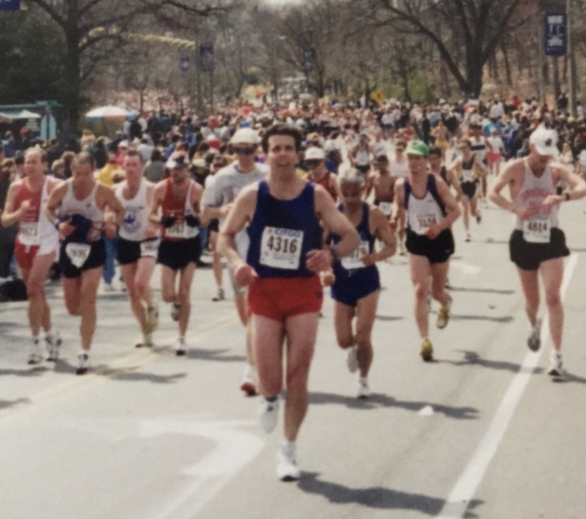 Tony Post running the Boston Marathon amid a pack of competitors