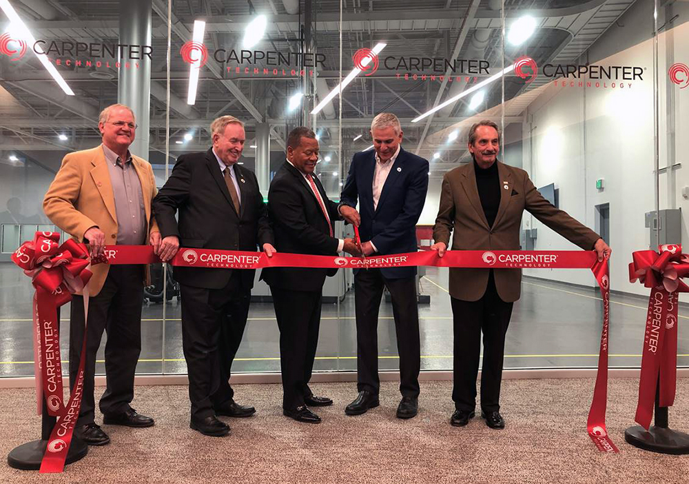 Carpenter Technology and Alabama economic development officials cutting a red ribbon at the Emerging Technology Center