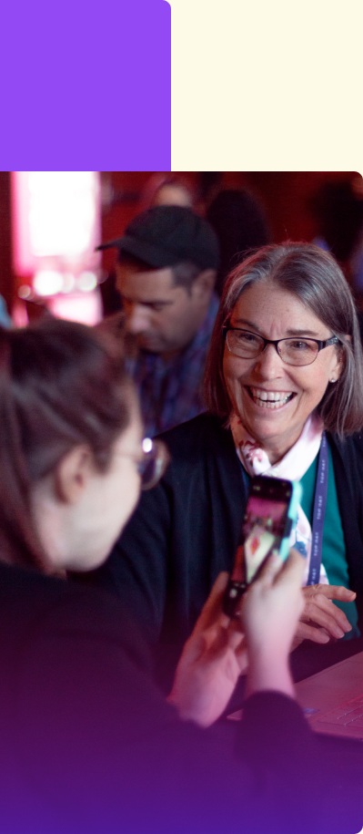 An attendee being interviewed in a photograph published on Top Hat’s company story page