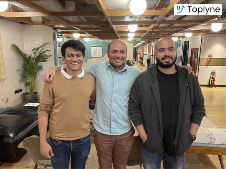 Toplyne co-founders Ruchin Kulkarni, Rohit Khanna and Rishen Kapoor standing together in an office