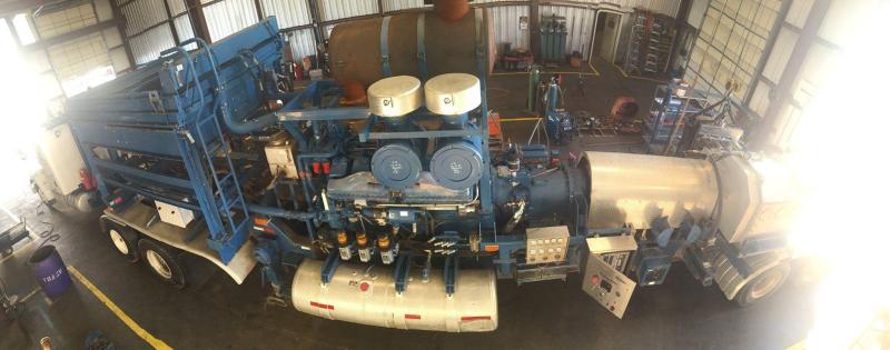 A blue frac unit inside the Total Equipment And Service workshop, seen from above