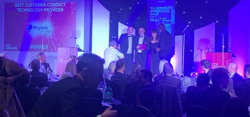 Paylink representatives on stage at the Collections and Customer Service Awards