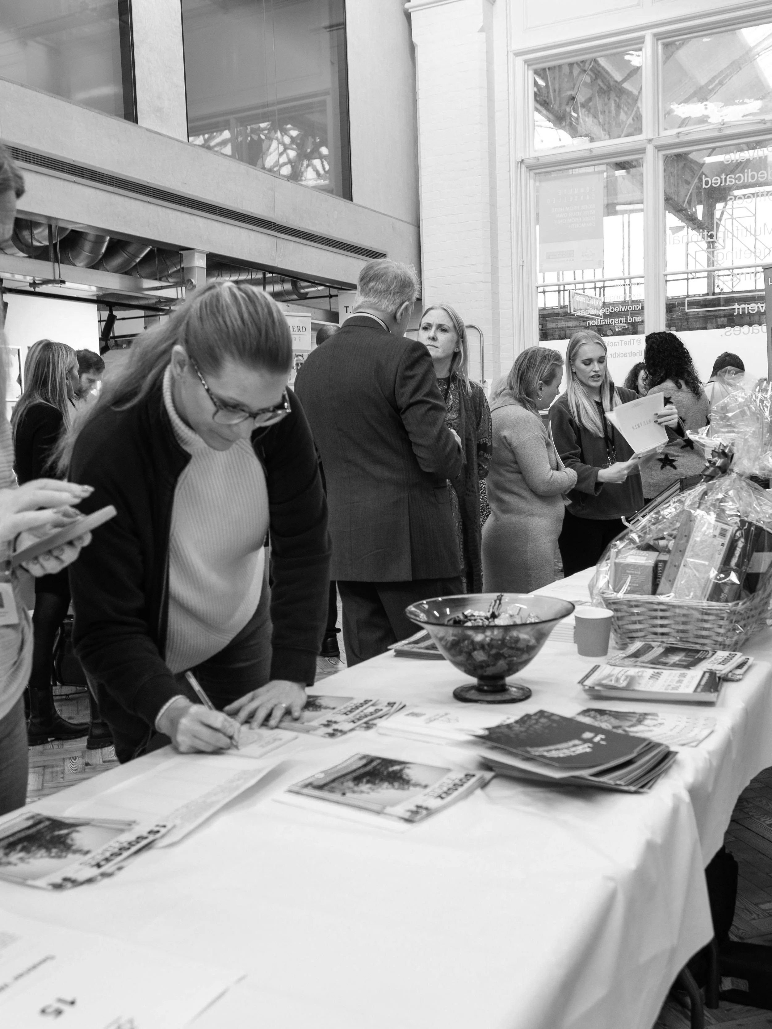 People meeting around display tables at TownSq’s The Track in Bognor Regis