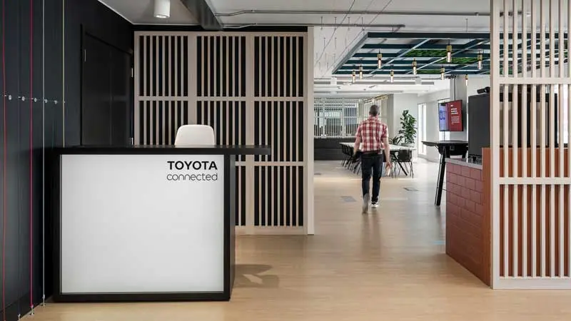Toyota Connected Europe office reception with wood panelling and company sign