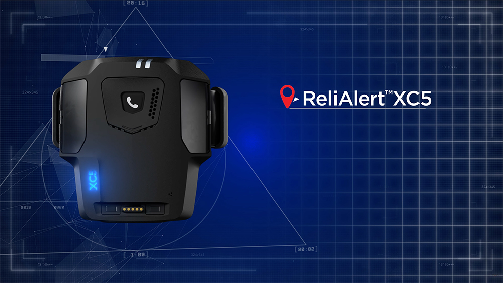 Track Group ReliAlert XC5 GPS monitoring device on a blue technical background