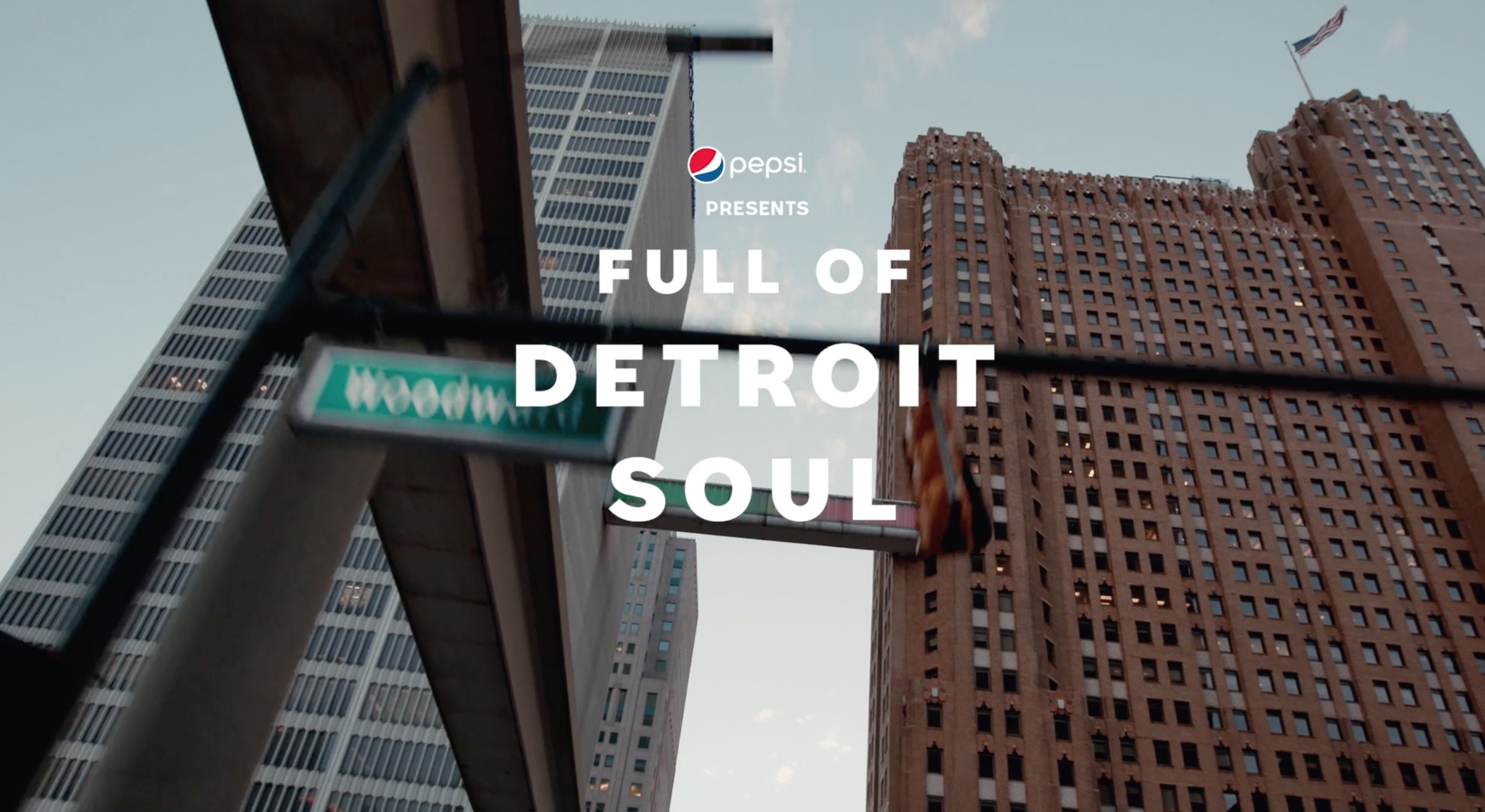 Detroit buildings and a Woodward Avenue sign in Pepsi’s Full of Detroit Soul campaign film