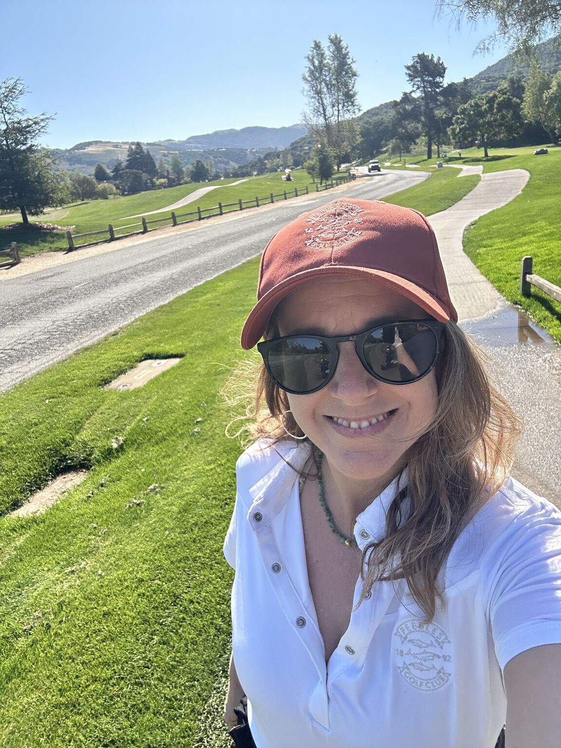 Tracy Pullman smiling on a sunny golf course