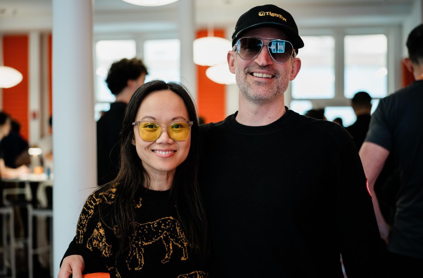 Tracy Young and Ralph Gootee smiling together, wearing TigerEye clothing