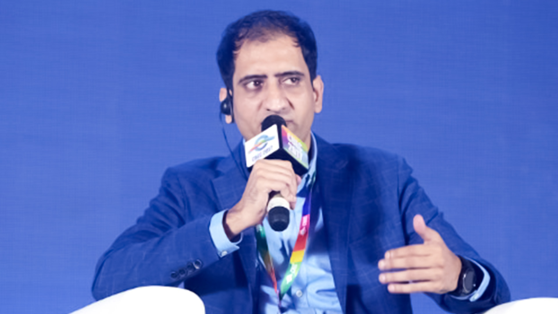 TradeWheel founder and CEO Noman Javed speaking into a microphone