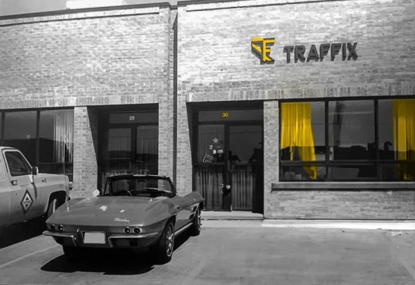 Archival TRAFFIX office with a car parked outside