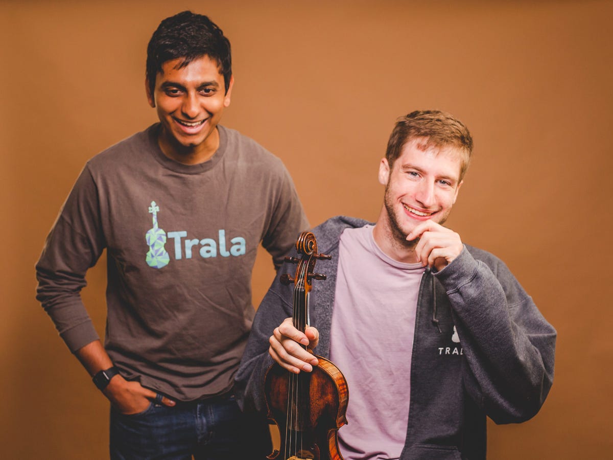 Trala co-founders Vishnu Indukuri and Sam Walder, with Walder holding a violin