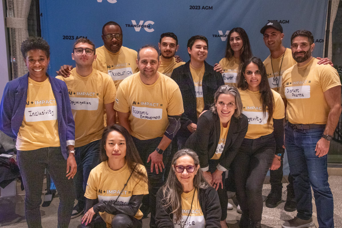 TRANSFORM VC annual-meeting participants wearing yellow AI and impact shirts in 2023